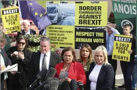  ?? LIAM MCBURNEY — PA VIA AP ?? Northern Ireland’s Sinn Fein party president Mary Lou McDonald speaks to the media with Sinn Fein Foyle MP Elisha McCallion, second from right, and Sinn Fein deputy leader Michelle O’Neill, right, after their meeting with British Prime Minister Boris Johnson.