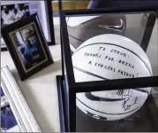  ?? PHOTOS BY GRACE TURNER / THE HERALD-SUN ?? One of Steve Mitchell’s pieces of Duke memorabili­a was a signed ball from coach Mike Krzyzewski. Mitchell died June 4 at age 62.