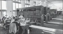  ?? BROOKS KRAFT LLC / FOR CHINA DAILY ?? Students work in the Langdell Hall Library at Harvard Law School. The campus at Fudan