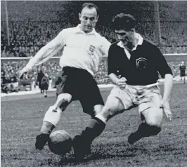  ??  ?? Ivor Broadis with his England caps and a photo of the 1954 squad. Above, playing Scotland at Hampden Park