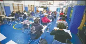  ?? (LaPresse/Cecilia Fabian) ?? High school students attend a lesson in gym-turned classroom to allow for social distancing after months of limited classroom presence in Rome.