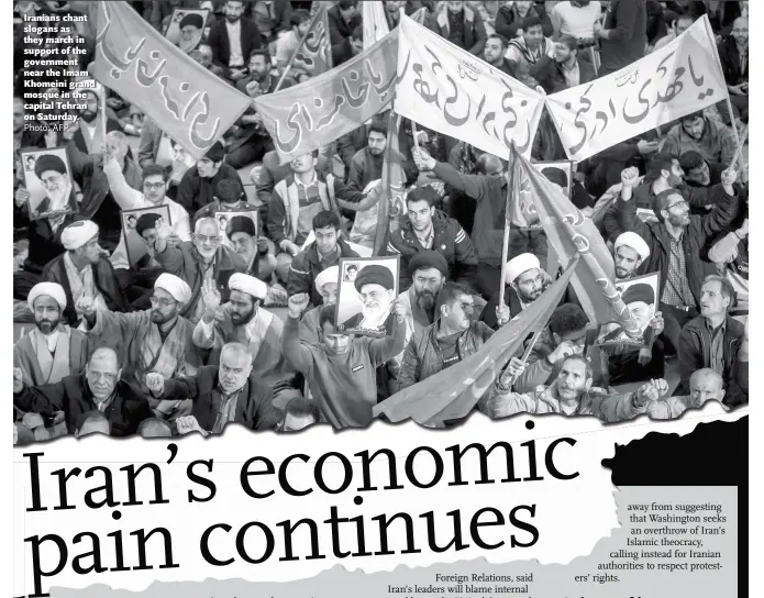  ?? Photo: AFP ?? Iranians chant slogans as they march in support of the government near the Imam Khomeini grand mosque in the capital Tehran on Saturday.