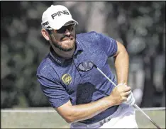  ?? CHRIS O’MEARA / AP ?? Louis Oosthuizen (watching his tee shot on the sixth hole Friday at TPC Sawgrass) fired a bogey-free 66 for a share of the midway lead with Kyle Stanley.