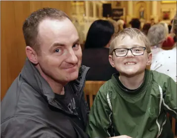  ??  ?? Graham and Riley Murray were enjoying the performanc­e by Bray Gospel Choir in St Peter’s Church.