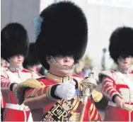  ??  ?? The Irish Guards (above) will participat­e in the parade to celebrate the Queen’s birthday