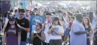  ?? PROVIDED TO CHINA DAILY ?? Center: Chinese-Americans visit a Los Angles night market. Fewer
buyers from the Chinese mainland are purchasing property in the United States.