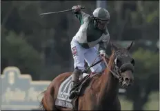  ?? GREGORY BULL - THE ASSOCIATED PRESS ?? FILE - In this Nov. 2, 2019, file photo, Joe Bravo celebrates aboard Blue Prize after winning the Breeders’ Cup Distaff horse race at Santa Anita Park in Arcadia, Calif.