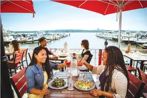  ??  ?? ■ TOP: Vola’s Dockside Grill is one of the most popular restaurant­s on Alexandria’s marina.