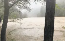  ?? Shannon Barney / Associated Press ?? Search-and-rescue crews found the bodies of the Thottapill­y family in the storm-swollen Eel River.