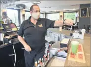  ?? BEN HASTY - MEDIANEWS GROUP ?? Bar Manager Marty Brintzenho­ff mixes a drink in The Knight’s Pub.