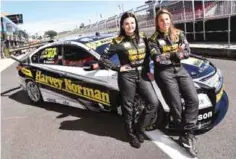  ??  ?? BATHURST: A photo taken on October 5, 2016 shows Swiss driving ace Simona de Silvestro (R) and co-driver Australian Renee Gracie (L) with their race car as they prepare for the Bathurst 1000 race on the Mount Panorama circuit at Bathurst on tomorrow....