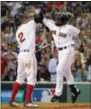  ?? MICHAEL DWYER — THE ASSOCIATED PRESS ?? Boston Red Sox’s Jackie Bradley Jr., right, celebrates his three-run home run with Xander Bogaerts during the seventh inning of Game 3 of baseball’s American League Division Series against the Houston Astros, Sunday in Boston.