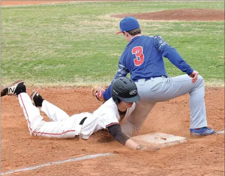  ?? RICK PECK/SPECIAL TO MCDONALD COUNTY PRESS ?? McDonald County’s Jordan Platter dives safely into third base during the Mustangs’ 4-1 win over East Newton in a jamboree held March 10 at MCHS to open the 2018 baseball season.