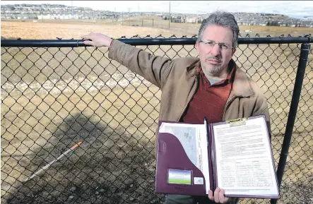  ?? RYAN MCLEOD ?? Tim Dixon, a resident in the community of Discovery Ridge, is petitionin­g the government to come up with a barrier between the community he lives in and the southwest ring road to address noise and safety issues.