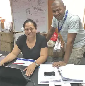  ?? Photo: Selita Bolanavanu­a. ?? Fiji Commerce & Employers Federation Programme officer Suka Salusalu and research officer Savenaca Baro busy preparing tomorrow’s event at Shangri-La’s Fijian Resort and Spa.