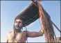  ?? PTI ?? ▪ A Naga sadhu dries up his hair after taking a holy dip at Sangam on the occasion of Basant Panchami at Kumbh in Prayagraj on Sunday.