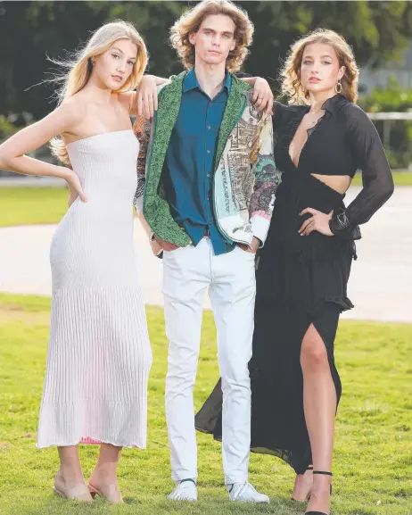  ?? ?? Models Abbey Knapp, Kieran Knapper and Madeline BM wear some of the fashion that will be on show at the Queensland Arts & Fashion Festival. Picture Glenn Hampson