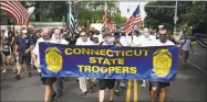  ?? Jessica Hill / Associated Press ?? People participat­ing in a “Back the Blue” rally to show support for law enforcemen­t officers march toward the state Capitol on Thursday in Hartford.