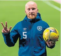  ??  ?? Liam Boyce with the match ball on Friday night