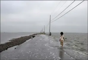  ?? (Special to the Democrat-Gazette/Stacy Kranitz) ?? Stacy Kranitz’ “Island Road,” from The Island series, Isle de Jean Charles, La., 2010, is part of “Southbound: Photograph­s of and About the New South,” at Windgate Museum of Art at Hendrix College in Conway.