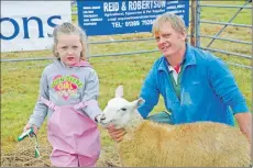  ?? 17_T32_LornShow02 ?? Andy Bevis and his five-year-old daughter Ella were successful in the young lamb class.