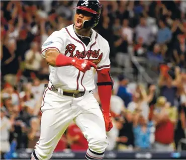  ?? AP PHOTO/JOHN AMIS ?? The Atlanta Braves’ Ronald Acuna Jr. runs to first after hitting a grand slam against the Los Angeles Dodgers in Game 3 of the National League Division Series on Oct. 7. Acuna was named the NL Rookie of the Year on Monday.