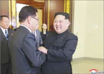  ?? KOREA NEWS SERVICE VIA AP ?? North Korean leader Kim Jong Un, right, meets South Korean National Security Director Chung Eui-yong in Pyongyang, North Korea.