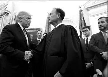  ?? DOUG MILLS / NEW YORK TIMES FILE (2019) ?? Justice Samuel Alito, center, shakes hands with President Donald Trump in the Oval Office on July 23, 2019.