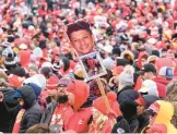  ?? REED HOFFMAN/AP ?? Fans take in the Chiefs’ Super Bowl victory celebratio­n and parade Wednesday in Kansas City, Missouri. The Chiefs rallied past the Eagles 38-35 on Sunday.