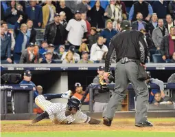  ?? HOWARD SIMMONS/NEW YORK DAILY NEWS ?? Yankee Didi Gregorius scores on a sacrifice fly against the Astros during Game 4 of the American League Championsh­ip Series. Houston led 4-0, but the Yankees responded to take a 6-4 victory.