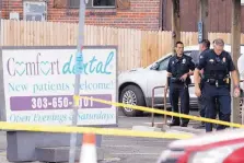 ?? DAVID ZALUBOWSKI/ASSOCIATED PRESS ?? Law enforcemen­t officials investigat­e the scene of a shooting in a parking lot behind a Colorado’s dentist’s office Thursday in Westminste­r, Colo.