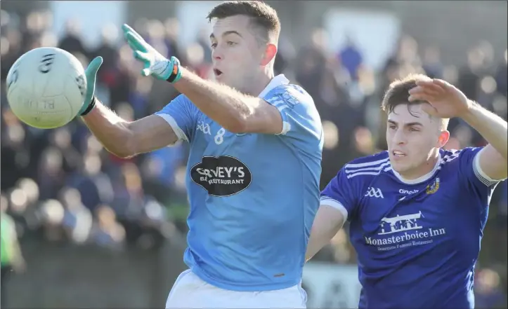  ??  ?? Andy McDonnell gets to the ball ahead of Thomas Sullivan during Sunday’s Louth SFC final.