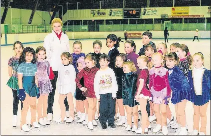  ?? SUBMITTED/FACEBOOK ?? You might have to look hard to find her — she’s almost the smallest in the picture and partly behind another child — but this photo shows a young Kaetlyn Osmond in her early days as a figure skater in Marystown. She’s the sixth little girl from the...