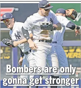  ?? Paul J. Bereswill ?? LET THE GOOD TIMES ROLL: Aaron Judge, who went 1-for-3 with a two-run home run in the first inning, celebrates with Giancarlo Stanton and Clint Frazier after the Yankees’ 4-3 victory over the Mariners on Thursday afternoon.