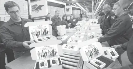  ??  ?? FLYING OUT THE DOOR: Trucks are being loaded with thousands of new medical alert devices called FastHelp. They are now being delivered to lucky seniors who call the National Rebate Center Hotline today. Everyone is calling to get FastHelp, the sleek new medical alert device because it instantly connects you to free unlimited help anytime, anywhere nationwide with no contracts, no deposits and no monthly bills ever.