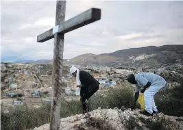  ?? DIEU NALIO CHERY / THE ASSOCIATED PRESS ?? Haitians perform a voodoo ceremony before a service Friday near Port-au-Prince honouring victims of the 2010 earthquake. The service was held amid outrage over Donald Trump’s disparagin­g references to Haitian refugees.