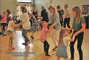  ??  ?? Families enjoy the ceilidh in Caol community centre.