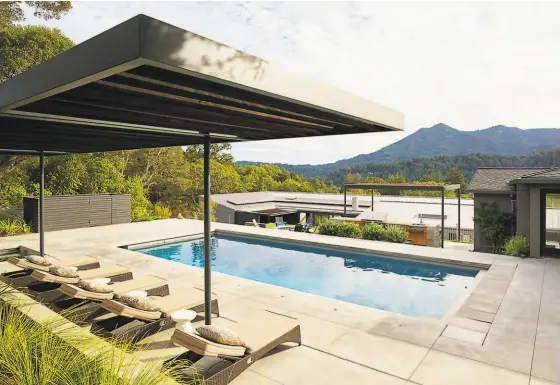  ?? Matthew Millman Photograph­y ?? The swimming pool at this home in Ross designed by Fischer Architectu­re doubles as the water source for an onsite hydrant that firefighte­rs can connect their trucks to.