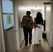  ?? AP PHOTO/REBECCA BLACKWELL, FILE ?? A 33-year-old mother of three from central Texas is escorted down the hall by clinic administra­tor Kathaleen Pittman prior to getting an abortion Oct. 9, 2021, at Hope Medical Group for Women in Shreveport, La.