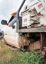  ??  ?? A farmer spreads feed for a cow-calf herd at Oklahoma State University. The cattle industry fears Chinese tariffs because of impacts those could have on domestic markets.