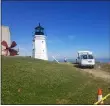  ?? JORDANA JOY — THE MORNING JOURNAL ?? New paint has been applied to the Vermilion lighthouse on the shore of Lake Erie. The project began June 15 and was slated to be finished by the end of the week.