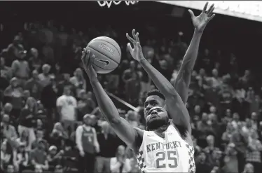  ?? MARK CORNELISON/TRIBUNE NEWS SERVICE ?? Kentucky's Dominique Hawkins (25) converts a driving shot in overtime against Georgia on Tuesday in Lexington, Ky.