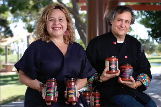  ?? STEVE MARCUS ?? Monica Marful and her husband, Alfonso Fredesvint­o Perez, received an Impacto Hispanic Business Accelerato­r grant from Pepsico that helped kickstart their sauce-making business.