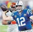  ?? TNS FILE PHOTO ?? Colts quarterbac­k Andrew Luck is under pressure from the Cincinnati Bengals on Sunday.