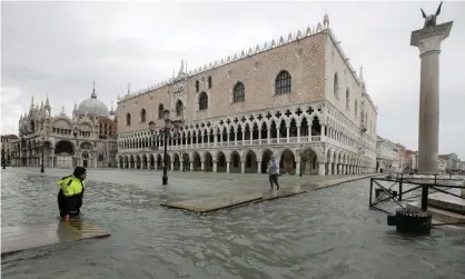  ??  ?? Venetians were hit by a high water of 150cm on Sunday. Photograph: Luca Bruno/AP