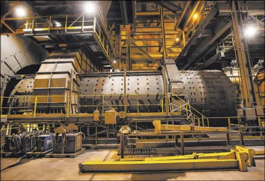  ?? Chase Stevens Las Vegas Review-Journal @csstevensp­hoto ?? A 10,000-horsepower wraparound motor sits on a dry grinding double rotator mill at Nevada Gold Mines’ Carlin operation. “It’s not a stretch to say that we’ll (still) be here in 30 to 40 years,” said Greg Walker, executive managing director of the joint venture.