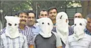  ?? SUSHIL KUMAR/HT PHOTO ?? The four, accused (with masks) of kidnapping the son of a former municipal councillor, in police custody.