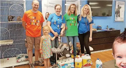  ?? [PHOTO BY CARLA HINTON, THE OKLAHOMAN] ?? Adam Wile; Evie Nagy, 5; Shannon Nagy; Wren Nagy, four months; Bernadette Wile; and Brittany Copeland, Central Oklahoma Humane Society pet adoption specialist, pose for a picture on July 9 at the humane society, 7500 N Western.