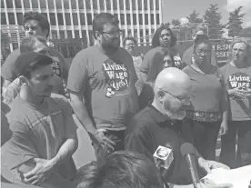  ??  ?? Scott Martindale, an MTSU facilities services employee, and other members of United Campus Workers expressed concerns about Gov. Bill Haslam’s plans to privatize the operations and management of state-owned buildings and property before delivering a letter to officials in charge of the project in Nashville. RICHARD LOCKER / THE COMMERCIAL APPEAL