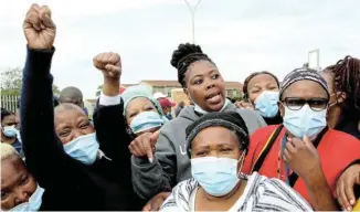  ?? Picture: FREDLIN ADRIAAN ?? STAFF DEMANDS: Healthcare workers protest outside the Dora Nginza Hospital over outstandin­g back pay. They were dispersed with stun grenades and teargas after blocking ambulances from entering the hospital